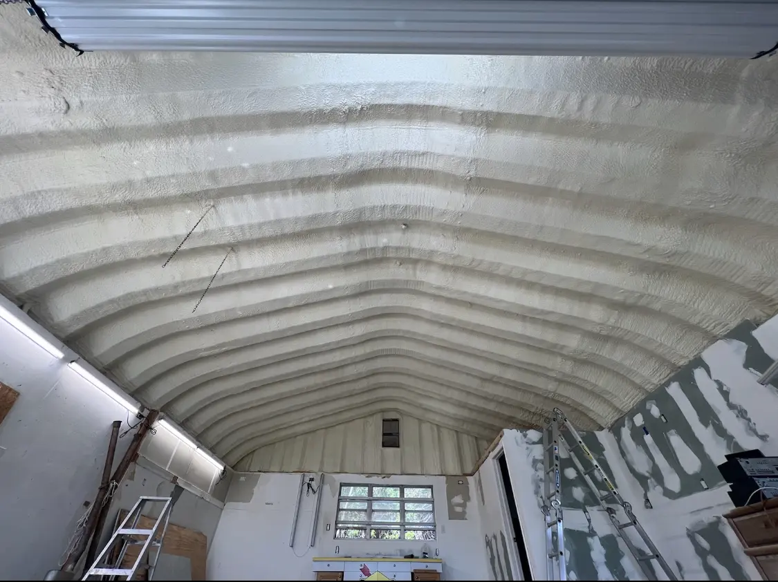 Spray polyurethane foam applied to the underside of a metal roof deck in Loves Park